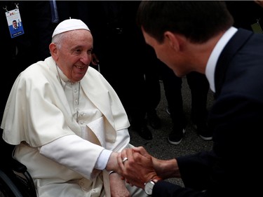 Pope Francis is welcomed by Canada's Prime Minister Justin Trudeau after arriving at Edmonton International Airport, near Edmonton, Alberta, Canada July 24, 2022.