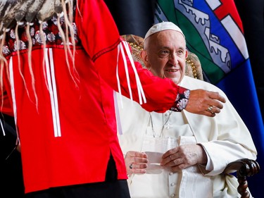 Pope Francis is greeted by Confederacy of Treaty Six First Nations Grand Chief George Arcand during a welcome ceremony at Edmonton International Airport, near Edmonton, Alberta, Canada July 24, 2022.