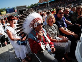 Indigenous Canadian leader Phillip Fontaine sits as Pope Francis presides a mass at Commonwealth Stadium in Edmonton, Alberta, Canada July 26, 2022.