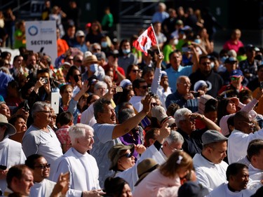 People watch as Pope Francis arrives to preside a mass at Commonwealth Stadium in Edmonton, Alberta, Canada July 26, 2022.