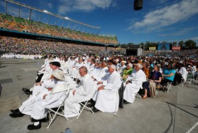 People attend a mass led by Pope Francis at Commonwealth Stadium during his visit to Edmonton, Alberta, Canada July 26, 2022.