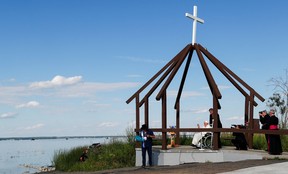 Pope Francis blesses the water of the lake as he attends the Lac Ste. Anne Pilgrimage, an annual pilgrimage that welcomes tens of thousands of Indigenous participants from throughout Canada and the United States each year, at Lac Ste. Anne, Alberta, Canada July 26, 2022.