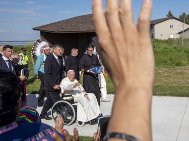 Pope Francis sprinkles the blessed water enroute to the Shrine on Tuesday,July 26, 2022 at Lac Ste. Anne.   Pope Francis is visiting Canada to apologize to Indigenous survivors of abuse committed over decades at Catholic Church run residential schools.