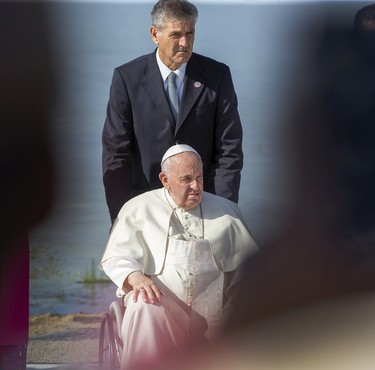 Pope Francis sprinkles the blessed water enroute to the Shrine on Tuesday,July 26, 2022 at Lac Ste. Anne.   Pope Francis is visiting Canada to apologize to Indigenous survivors of abuse committed over decades at Catholic Church run residential schools.