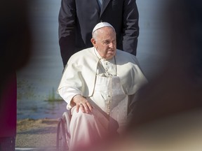 Pope Francis sprinkles the blessed water enroute to the Shrine on Tuesday,July 26, 2022 at Lac Ste. Anne.   Pope Francis is visiting Canada to apologize to Indigenous survivors of abuse committed over decades at Catholic Church run residential schools.