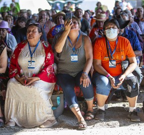 People watch as Pope Francis takes part in the Liturgy of the Word (Prayer Service) at the Shrine on Tuesday, July 26, 2022 at Lac Ste. Anne. Pope Francis is visiting Canada to apologize to Indigenous survivors of abuse committed over decades at Catholic Church run residential schools.