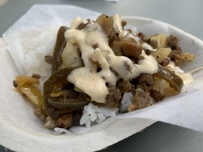 The pork sisig and rice (three tickets) from Joanne’s BBQ Truck on food truck row at the 2022 Taste of Edmonton is a bargain that leaves you wanting more sisig and less rice. Reviewed on July 21, 2022.
