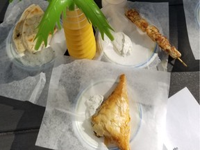 From left, Pita Bread with Tzatziki, Spanakopita with Tzatziki, Chicken Souvlaki with Tzatziki, all from Koutouki Its All Greek To Me (booth 9). Mango and Coconut Smoothies from Coconut Jungle (booth 7).