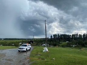 Photos show the destruction caused by a suspected tornado on Township Road 320, about 13 kilometres west of Olds.