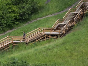 Edmonton weather: Get into bed, stay there until the rain stops A person walks down stairs in the river valley across the North Saskatchewan River from Gold Bar Park in Edmonton on Monday, July 4, 2022.