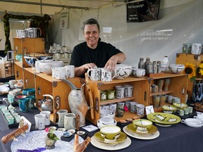 Enzien Kufeld of Urban Forest Design Studio sells pottery at the 2022 Edmonton Folk Music Festival Artisan Market.