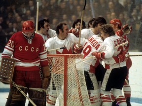 Paul Henderson, No. 19, celebrates with teammates after scoring the game-winning goal against the Soviet Union’s Vladislav Tretiak during Game 7 of the 1972 Summit Series, Sept. 26, 1972.