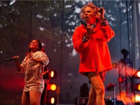 Meah Pace, left, and Nic Offer turning up the heat near the end of the !!! show Saturday at Hawrelak Park.