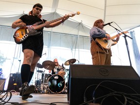Nimal Agalawatte, left, William Fachin and Chrisy Hurn of Basement Revolver at Purple City 2022.