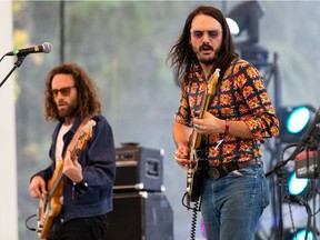 Michael Rault (right) and his band perform during the 2022 Purple City Music Festival at Hawrelak Park Amphitheatre.