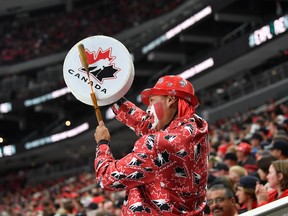 A fan bangs a drum during the game against Finland in the IIHF World Junior Championship on Aug. 20, 2022 at Rogers Place.