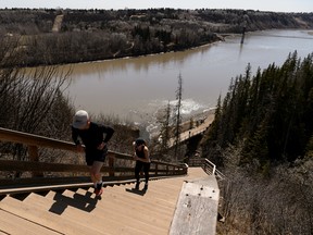 Runners and cyclists exercise on the stairs rising from Wolf Willow Ravine in Edmonton, on Sunday, April 21, 2019.