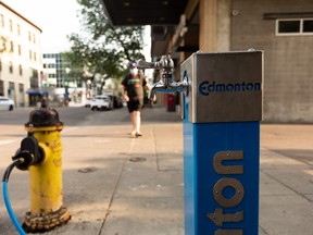 A City of Edmonton temporary water faucet for the public is seen attached to a Downtown fire hydrant in Edmonton in 2021. The city lifted its extreme weather response on Monday, Aug. 22, due to cooler temperature forecasted for the rest of the week.