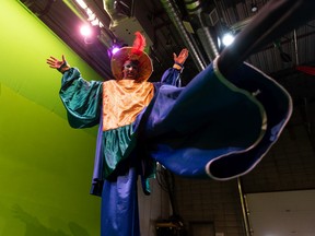 Randall Fraser, artistic director with National Stiltwalkers of Canada, does high kicks in a stiltwalker costume at the organization's Edmonton studio on Thursday, Aug. 18, 2022. Photo by Ian Kucerak