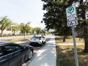 A City of Edmonton parking regulation sign is seen along University Avenue in the Belgravia neighbourhood of Edmonton, on Tuesday, Aug. 23, 2022. City council is reviewing parking rules going forward.