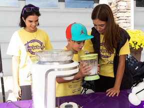 (Left to right) The Chapman kids, Brooklyn, 14, Hunter, 10, and Daniella, 13, Chapman make lemonade at the Chapman family lemonade stand during the 9th Annual Simply Supper Lemonade Stand Day in support of the Stollery Children’s Hospital in Edmonton, on Sunday, Aug. 28, 2022. The event saw 1400 kids run 415 lemonade stands in Edmonton and the surrounding communities.