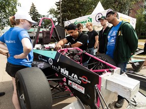 Members of the UAlberta Formula Racing Team work on their most powerful race car in the team's history, UA-22, which was designed, fabricated and marketed entirely by students at the university in less than a year at the University of Alberta in Edmonton, on Sunday, Aug. 28, 2022.