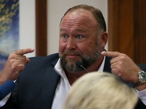 Alex Jones is called up to testify at the Travis County Courthouse during the his defamation trial, in Austin, U.S. August 2, 2022.