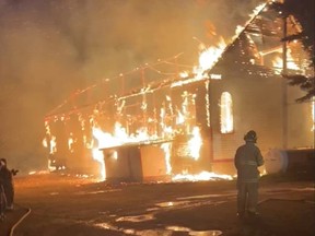 Firefighters in Fort Chipewyan respond to a fire at the Nativity of the Blessed Virgin Roman Catholic Church in a screenshot from a Facebook Live video shot by Chief Allan Adam on Thursday, Aug. 25, 2022.