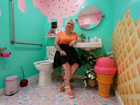 Julie Morrison, owner of the Edmonton boutique shop Majesty and Friends (10712 120 St.), sits in the store's restroom on August 17, 2022. The washroom won Cintas Canada's 13th annual Canada's Best Restroom competition. The winner is selected based on cleanliness, visual appeal, innovation, functionality and unique design elements. The award comes with a $2,500 credit for Cintas products and services.