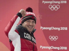 Canadian Justin Kripps celebrates his and teammate Alexander Kopacz's gold medal tie with Germany in the two-man bobsled at the Pyeongchang 2018 Winter Olympic Games in South Korea, Monday, Feb. 19, 2018. Bobsleigh Canada Skeleton announced in a Twitter post that the 35-year-old from Summerland, B.C., was calling it a career.