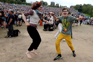 Festival goers dance to the music at the Edmonton Folk Music Festival, Saturday Aug. 6, 2022.