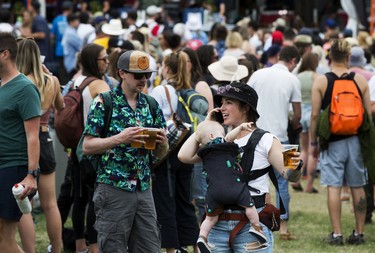 Attendees line up for beers at Edmonton Folk Music Festival, Saturday Aug. 6, 2022.