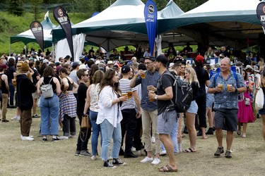 Attendees line up for beers at Edmonton Folk Music Festival, Saturday Aug. 6, 2022.