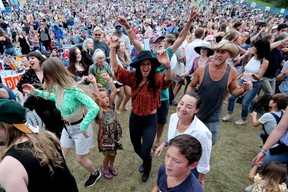 Festival goers de temps dance at Anton during the Edmonton Folk Music Festival, Saturday August 6, 2022.