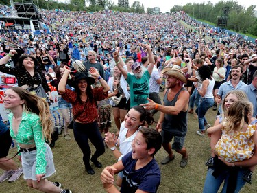 Festival goers dance to De Temps Antan during the Edmonton Folk Music Festival, Saturday Aug. 6, 2022.