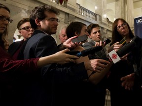 Reporters, like those seen scrumming Jason Kenney in this 2018 file photo, aren't often the focus of the news. Now many such journalists are receiving threats for doing their jobs. Ian Kucerak, Postmedia.