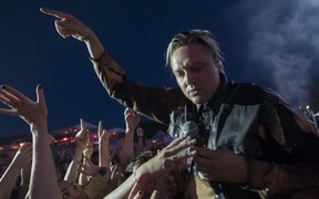Win Butler of the Montreal band Arcade Fire came down from the stage to have a brief encounter with fans on Day 1 of the Osheaga festival at Parc Jean-Drapeau in Montreal Friday, July 29, 2022.