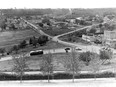 A view from MacDonald Drive of the Rossdale Flats in Edmonton in the early 1950s. Rossdale Power plant in background.