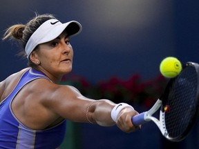 Bianca Andreescu, of Canada, returns the ball against Qinwen Zheng, of China, during the National Bank Open tennis tournament in Toronto on Thursday, August 11, 2022. The Mississauga, Ont., native enters the U.S. Open, where she won her lone career Grand Slam in 2019, after an impressive but shorter stay at the recent National Bank Open.