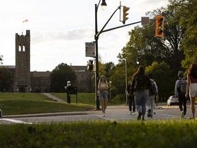 Students walk on the campus of Western University in London, Ontario.  on Wednesday, September 15, 2021. A group of Western University students plan to stage a protest today against the school's COVID-19 mandates.  The University of London, Ont., announced Monday that everyone on campus in the fall must have at least three COVID-19 shots and wear masks in classrooms.  THE CANADIAN PRESS/Nicole Osborne