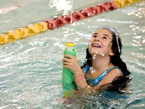 Eight year-old Derya G. swims at Edmonton's Scona Pool, 10450 72 Ave., with her mother, Wednesday, Aug. 24, 2022. City staff are recommending closing the pool permanently because of "significant system failures" and ongoing maintenance needs, according to a report heading to executive committee Aug. 24.