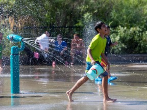 Kids beat the heat at Jackie Parker Park Spray Park in Edmonton on Thursday, August 25, 2022.