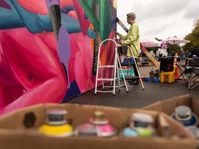 Ariel Durkin works on a colaborative piece with Peter Gegolgick during Grindstone's Mural Massive last fall.