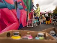 Ariel Durkin works on a colaborative piece with Peter Gegolgick during Grindstone's Mural Massive last fall.