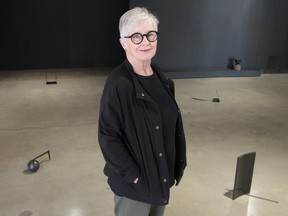 Catherine Burgess with some of the work in her show CORPUS at Peter Robertson Gallery.