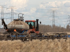 Pete Neustaeter and Keith Goutbeck seed a field for Share the Harvest's 20th annual crop for the Canadian Foodgrains Bank outside of Gibbons north of Edmonton, on Thursday, May 12, 2022. Photo by Ian Kucerak