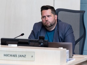 Coun. Michael Janz reacts as members of Chinatown's community speak about violence, lawlessness and criminality during a discussion about the Community Safety and Well-being Strategy at city council in Edmonton on May 24, 2022.