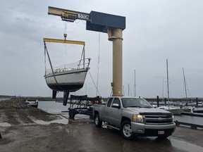 Many boat owners used the stationary crane at the Shediac Bay Yacht Club to lift their vessels out of the water Thursday as a hurricane is expected late Friday.