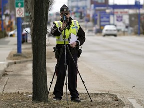 File photo of an Edmonton Police Service Constable tracking motorists speeding on 104 Street at 70 Avenue in Edmonton on Wednesday April 22, 2020. Police issued nearly 1,500 tickets — mostly for speed — in a traffic enforcement blits on Aug. 31.