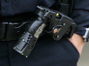 File photo of a police officer's holstered Taser X26 stun gun. ASIRT said an Edmonton police officer and former officer face assault charges following a March 2021 arrest that involved use of a Taser.